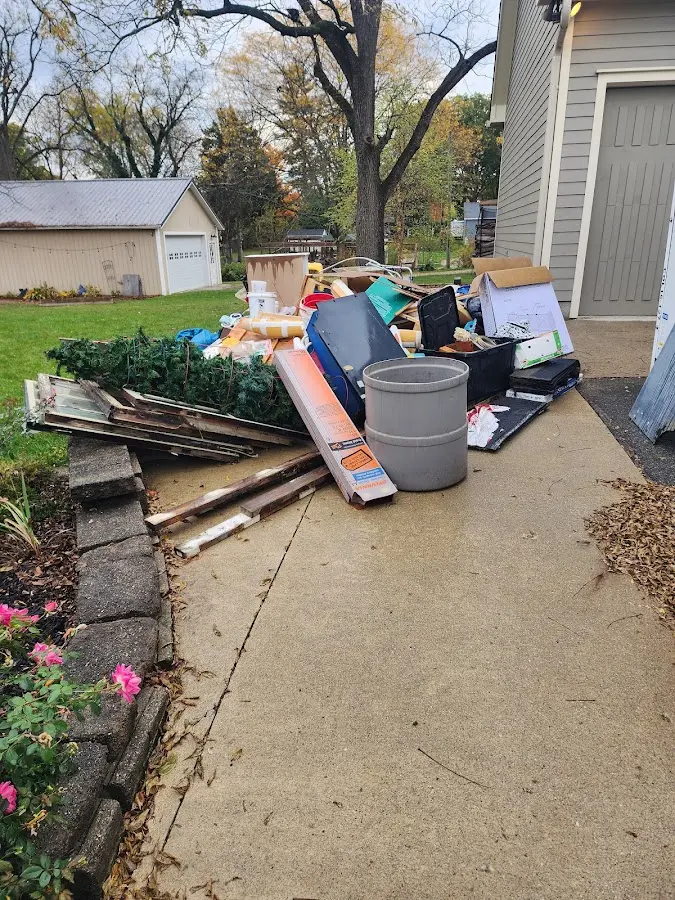 Dumpster being loaded with debris for Demolition Dumpster Rental in Michigan City